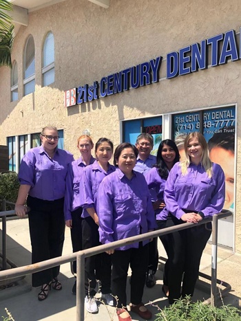 21st Century Dental Staff in front of the 21st Centural Dental building